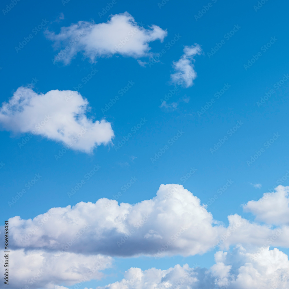 big white cumulus clouds in the blue sky as a natural background big white cumulus clouds in the blue sky as a natural background