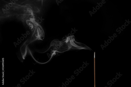Bild auf Leinwand Incense stick smokes on a black background