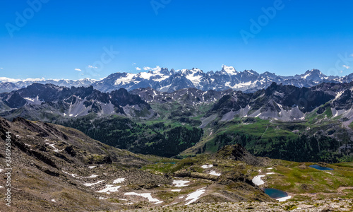 High altitude landscape in Alps with the view of Barre des Ecrins and La Meije in the distance. In the first plane there are The Lakes Gradioles on Claree Valley in Haute Alpes, Nevache.