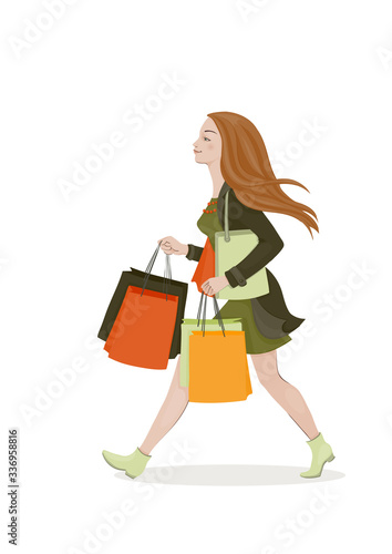 Young woman with red hair in a green dress and coat with bright shopping bags. Walking girl. Vector illustration. © caterina_k