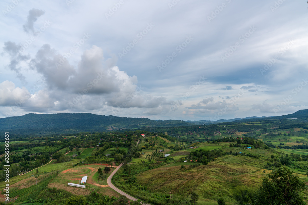 Obraz premium beautiful blue sky high peak mountains mist fog wildlife green forest at Khao Koh, Phu Tub Berk, Phetchabun, Thailand guiding idea long weekend for backpacker camping campfire relaxing hiking