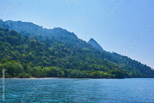 Tropical paradise beach with white sand and blue sky turquoise water and granite rocks travel tourism background concept. Amazing tropical holidays in paradise beaches of Tioman island, Malaysia. © eskstock