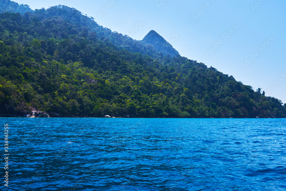 Beautiful nature landscape in Malaysia. Rain forest, mountains, ocean. View. Exploring tropical Tioman island. Travel concept and idea. Beautiful turquoise ocean.