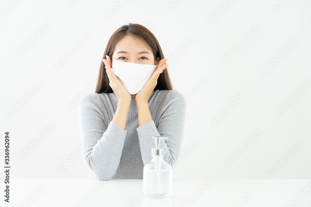 Woman happy wearing face mask Peace of mind, safe form spreading of disease virus SARS-CoV-2 and hand wash cleaning by alcohol gel, protection bacteria and virus, Covid-19 Coronavirus concept Woman happy wearing face mask Peace of mind, safe form spreading of disease virus SARS-CoV-2 and hand wash cleaning by alcohol gel, protection bacteria and virus, Covid-19 Coronavirus concept