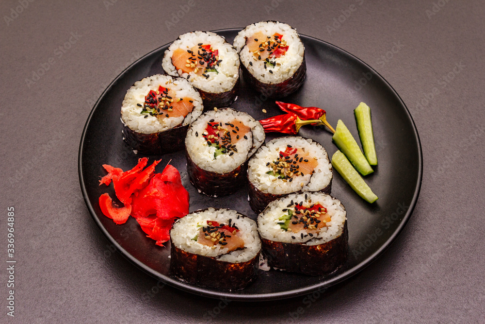 Korean roll Gimbap(kimbob). Steamed white rice (bap) and various other ingredients. Trendy black background Korean roll Gimbap(kimbob). Steamed white rice (bap) and various other ingredients. Trendy black background