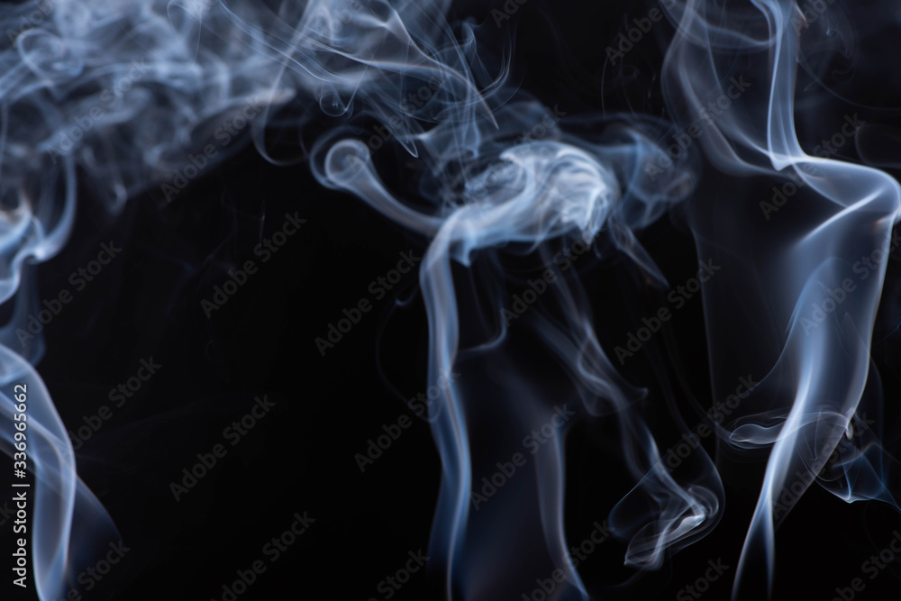 white flowing smoke cloud on black background