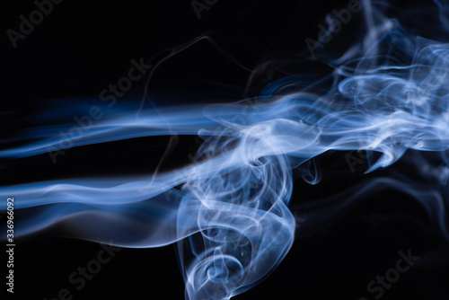 blue colorful flowing smoke on black background