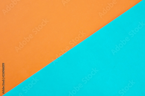 Background of two paper triangles, yellow and blue, connected together