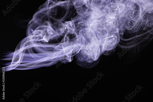 purple colorful flowing smoke on black background