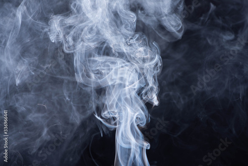 abstract white flowing smoke on black background