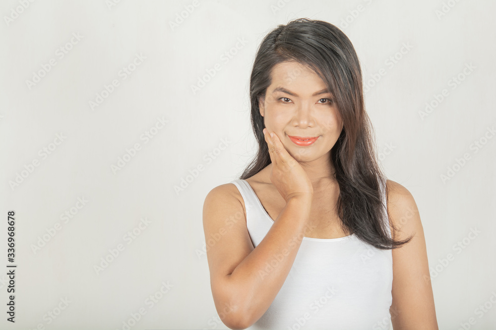 Woman and sweet smile. Thai style wearing a white shirt Woman and sweet smile. Thai style wearing a white shirt