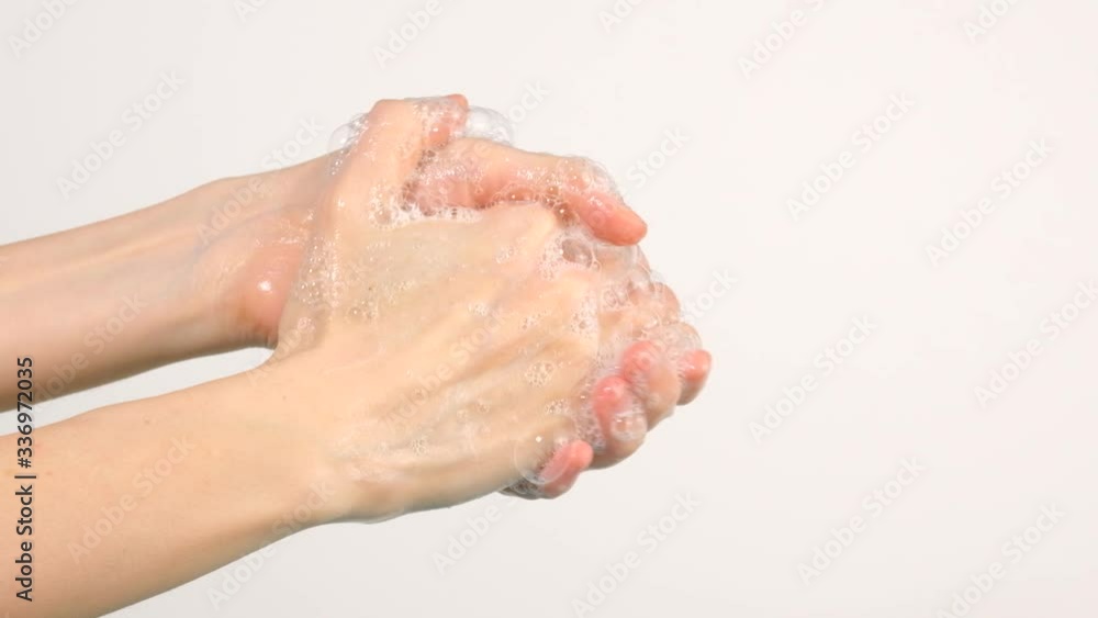 Caucasian woman washing her hands isolated on white background Caucasian woman washing her hands isolated on white background