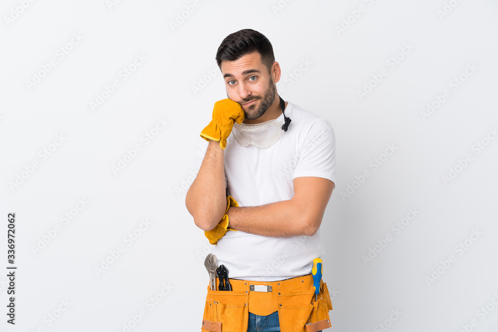 Craftsmen or electrician man over isolated white background unhappy and frustrated Craftsmen or electrician man over isolated white background unhappy and frustrated
