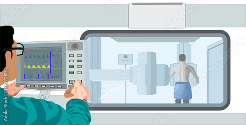 doctor in an x-ray room takes a picture of a man’s chest