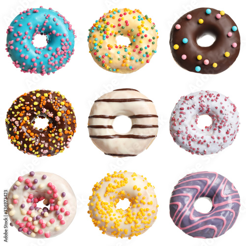 Set with delicious glazed donuts on white background