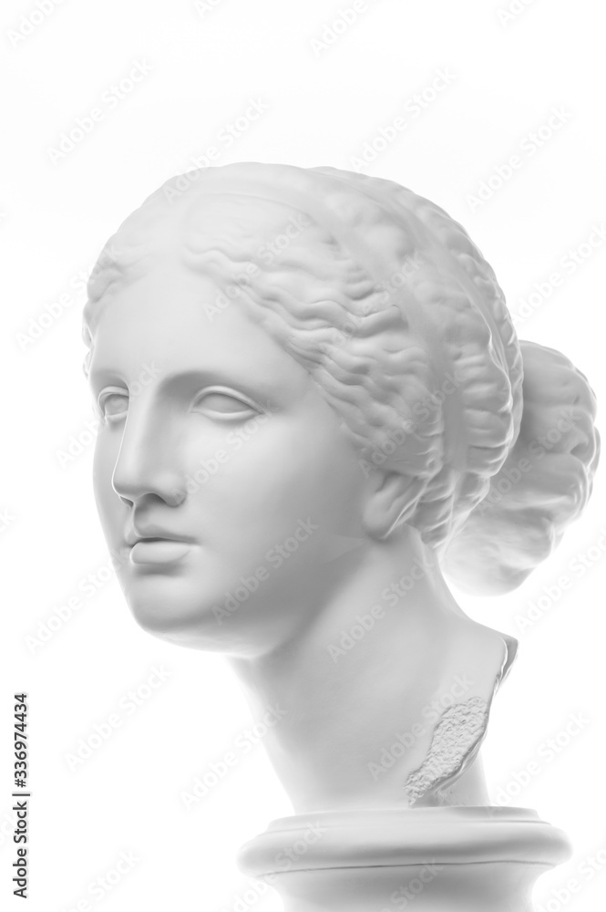 Gypsum copy of ancient statue Venus head isolated on white background. Plaster sculpture woman face. Gypsum copy of ancient statue Venus head isolated on white background. Plaster sculpture woman face.