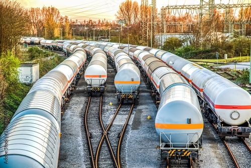 Freight train with petroleum tank-cars . terminal of freight cars . Transportation of liquid and dangerous goods by rail