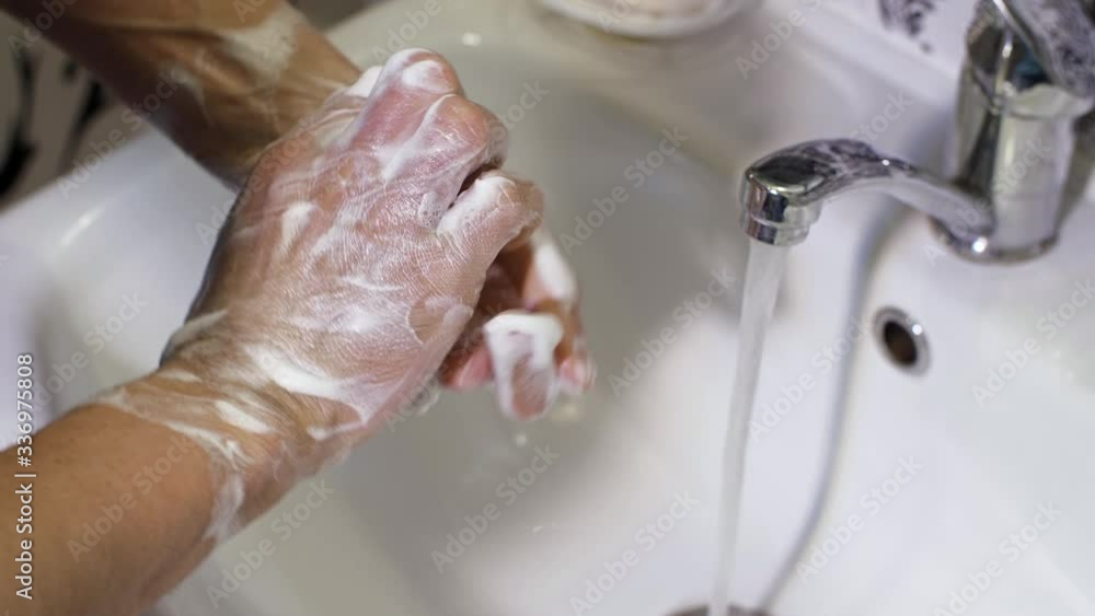 Man washing hands with soap Man washing hands with soap
