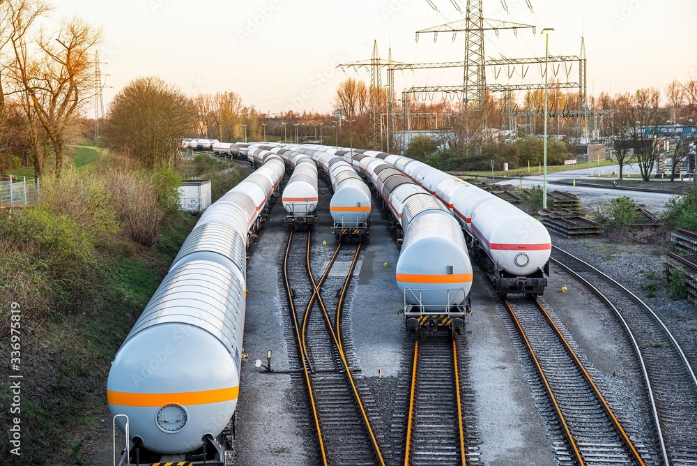 Freight train with petroleum tank-cars . terminal of freight cars . Transportation of liquid and dangerous goods by rail