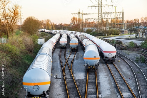 Obraz na płótnie Freight train with petroleum tank-cars . terminal of freight cars . Transportation of liquid and dangerous goods by rail w salonie