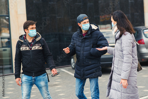Coronavirus global pandemic. People in a medical mask outdoors.