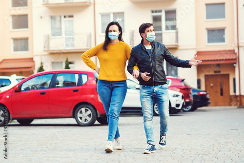 Couple in medical mask to prevent infection from spreading of Covid-19. Coronavirus quarantine.