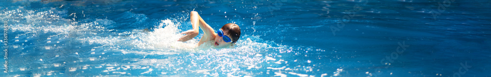 Panoramic image of a swimmer athlete crawling. Panoramic image of a swimmer athlete crawling.