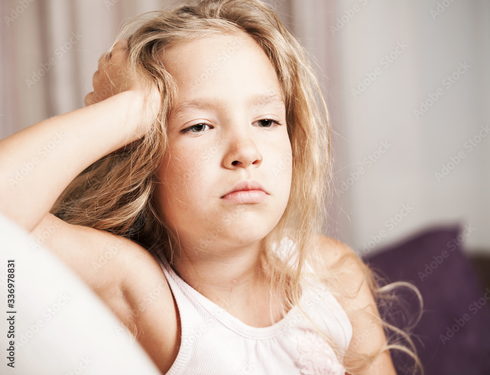 Fototapeta premium Sad little girl at home