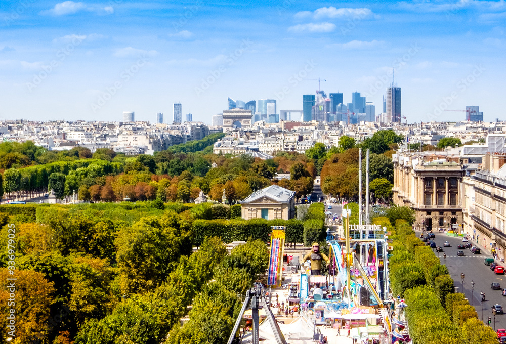 amusement park in the city of Paris, at the Louvre Museum, fun and attractions in the heart of the romantic city and view on new city and royal parks