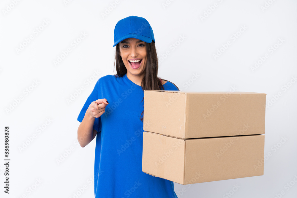 Young delivery woman over isolated white background points finger at you Young delivery woman over isolated white background points finger at you