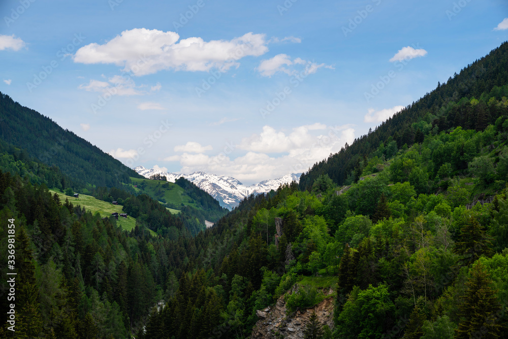 Panoramic view to the mountains. Snow covered Alps mountains on background. Switzerland, Europe.