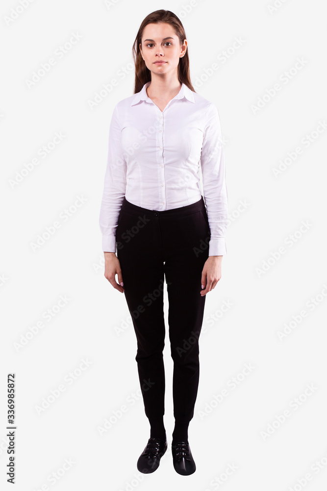 Girl stands straight and looks directly at camera. White background. Full length Girl stands straight and looks directly at camera. White background. Full length