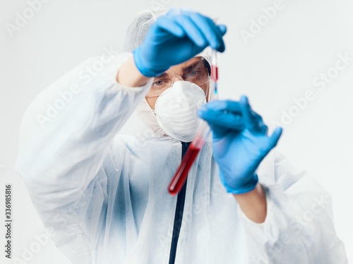 Male laboratory assistant diagnosing a blood test infection