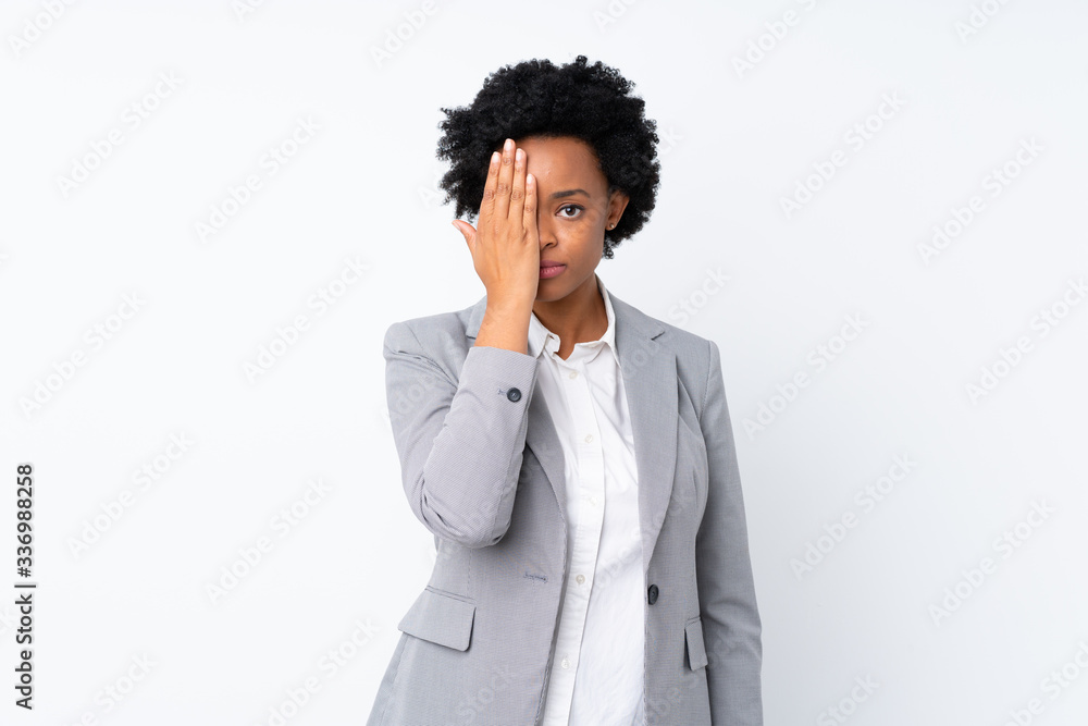 African american business woman over isolated white background covering a eye by hand African american business woman over isolated white background covering a eye by hand