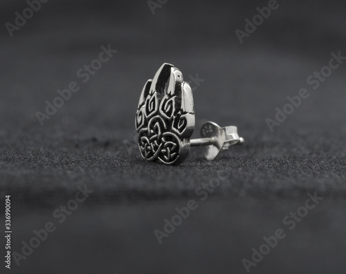 Silver jewelry. Stud Earring. Occult jewelry. Paw of a bear. Sign of Veles. photo