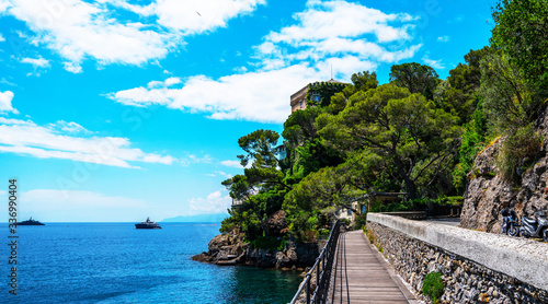 Sunny summer day  Italy. Summer landscape. Colorful seascape of Adriatic sea. Traveling concept background. Rock and boats  yachts in spectacular view near Portofino  Liguria  Italy  Europe.