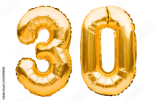 Number 30 thirty made of golden inflatable balloons isolated on white. Helium balloons, gold foil numbers. Party decoration, anniversary sign for holidays, celebration, birthday, carnival