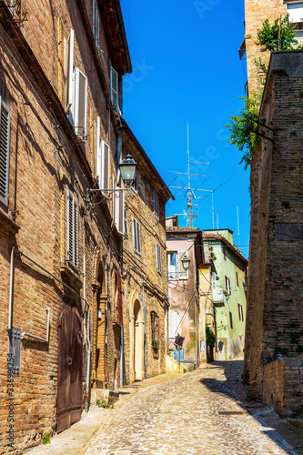 View of a beautiful narrow cobbled street in Fermo, Province of Fermo, Marche Region, Italy