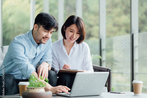 Young Asian business man and woman