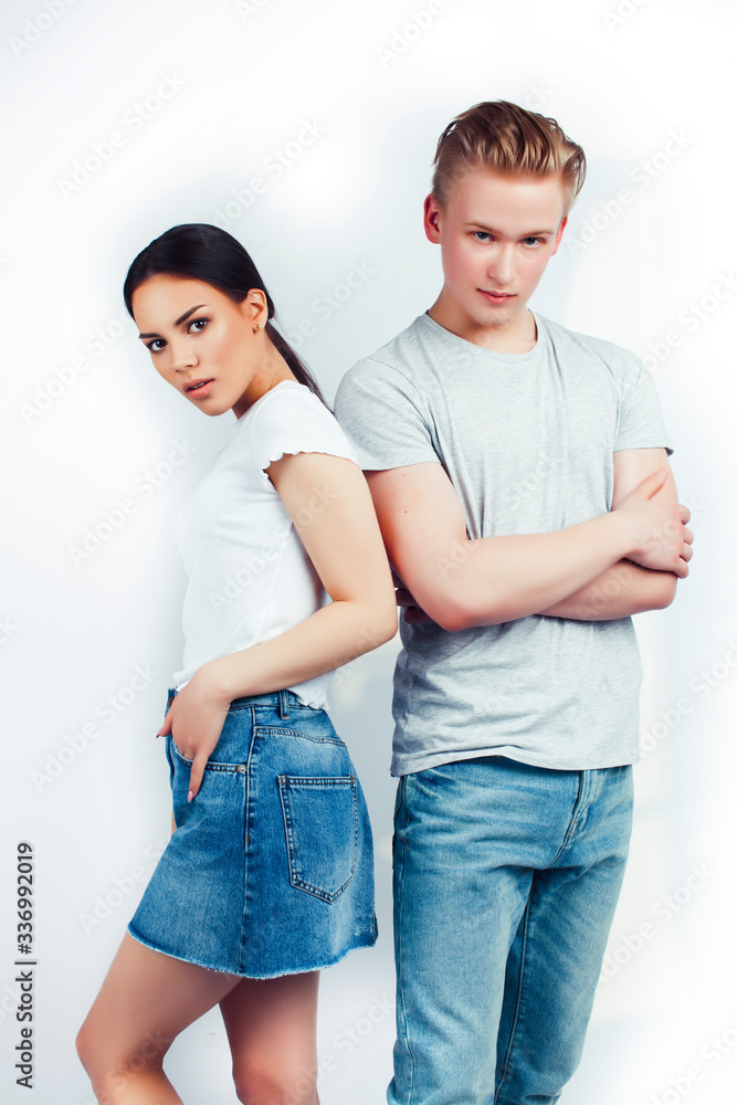 modern hipster guys together couple diverse nations, asian girl and caucasian blond boy isolated on white background, lifestyle people concept modern hipster guys together couple diverse nations, asian girl and caucasian blond boy isolated on white background, lifestyle people concept