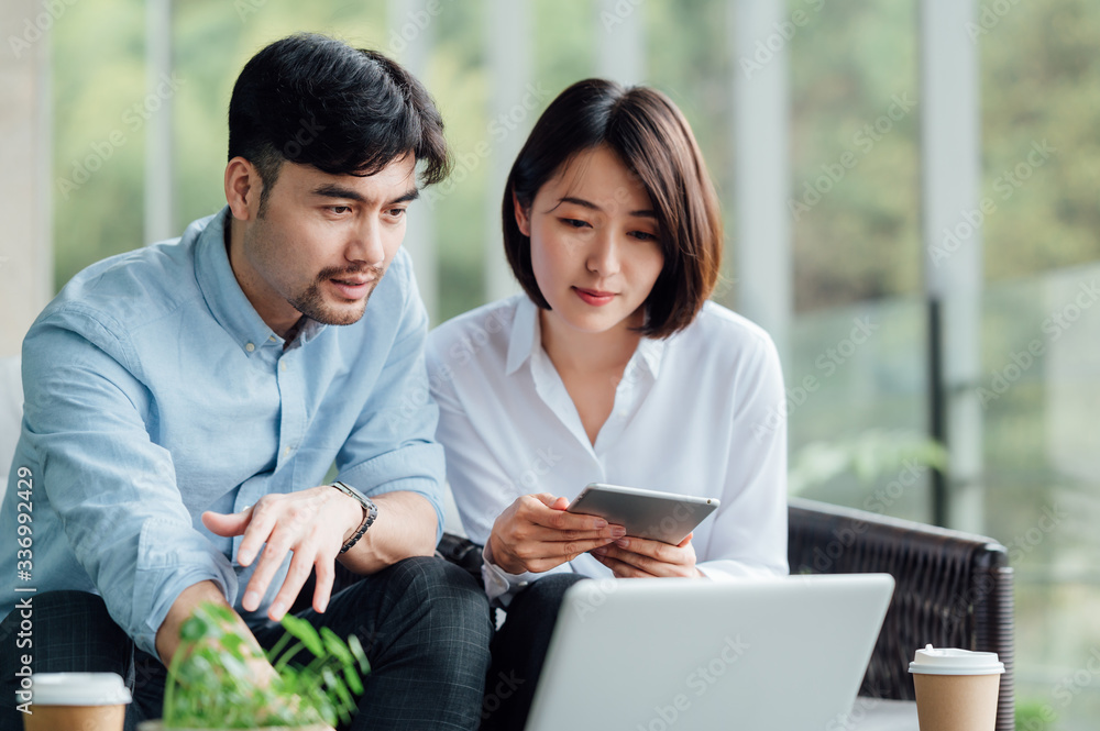 Young Asian business man and woman Young Asian business man and woman