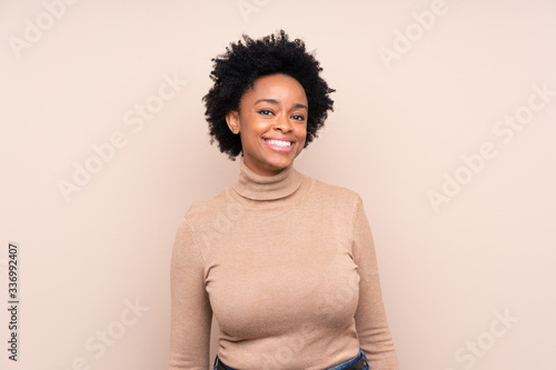 African american woman over isolated background laughing