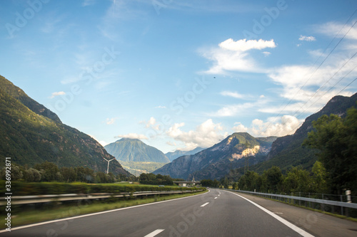 Asphalt road in Switzerland, road between the Alps mountains
