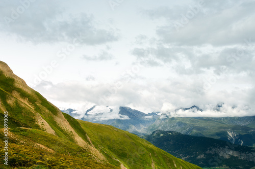 green alpine meadows mountains in switzerland