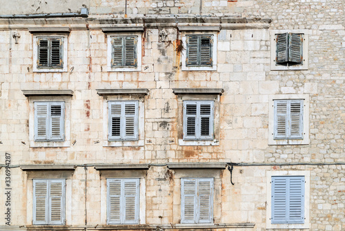 SPLIT, CROATIA - 2017 AUGUST 15. Old building In The Old Town Of Split with windows protected by closed wooden shutters.