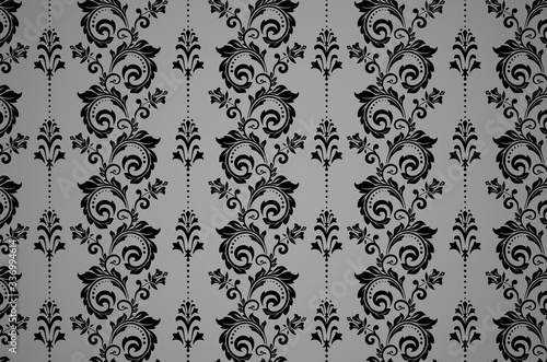 Wallpaper in the style of Baroque. Seamless vector background. Black and grey floral ornament. Graphic pattern for fabric, wallpaper, packaging. Ornate Damask flower ornament