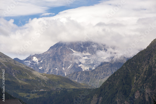 The mountains of Switzerland, the summits of the mountains with snow in summer