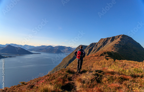ULSTEINVIK, NORWAY - 2017 SEPTEMBER 24. Mountain hiking in beautiful autumn weather with blue skye.