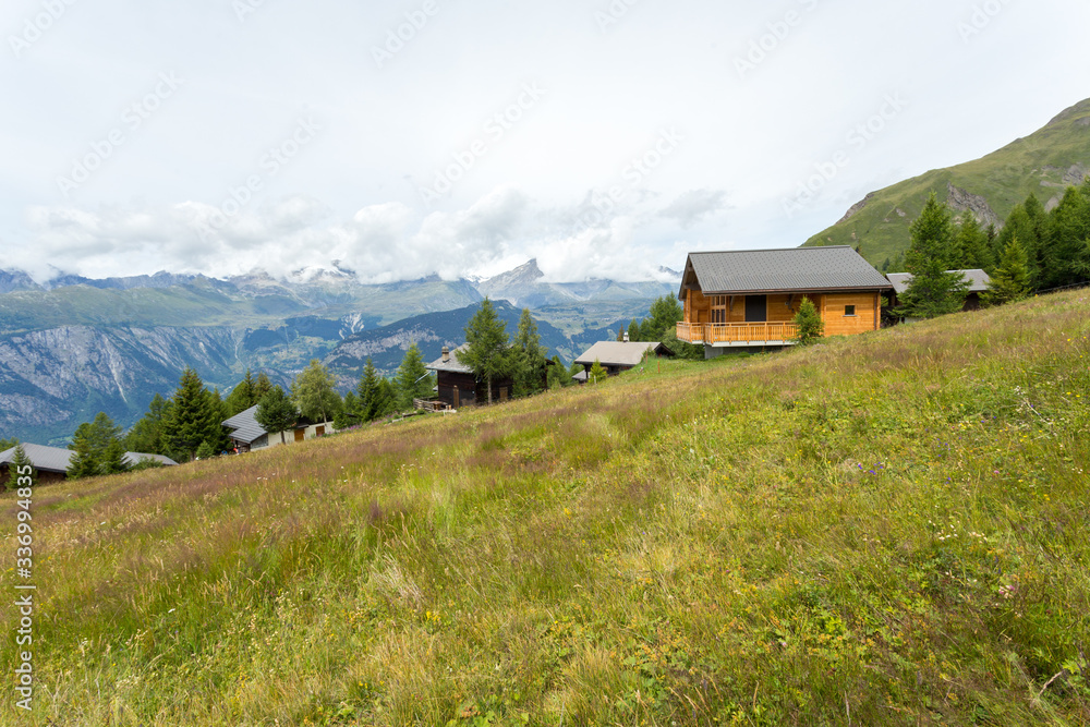 house in the mountains of switzerland, high mountain village