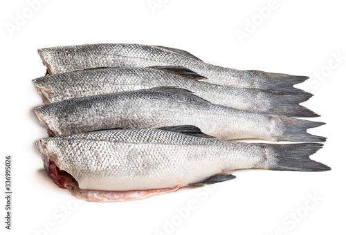Tableau sur toile Raw whole headless seabass fish isolated on white